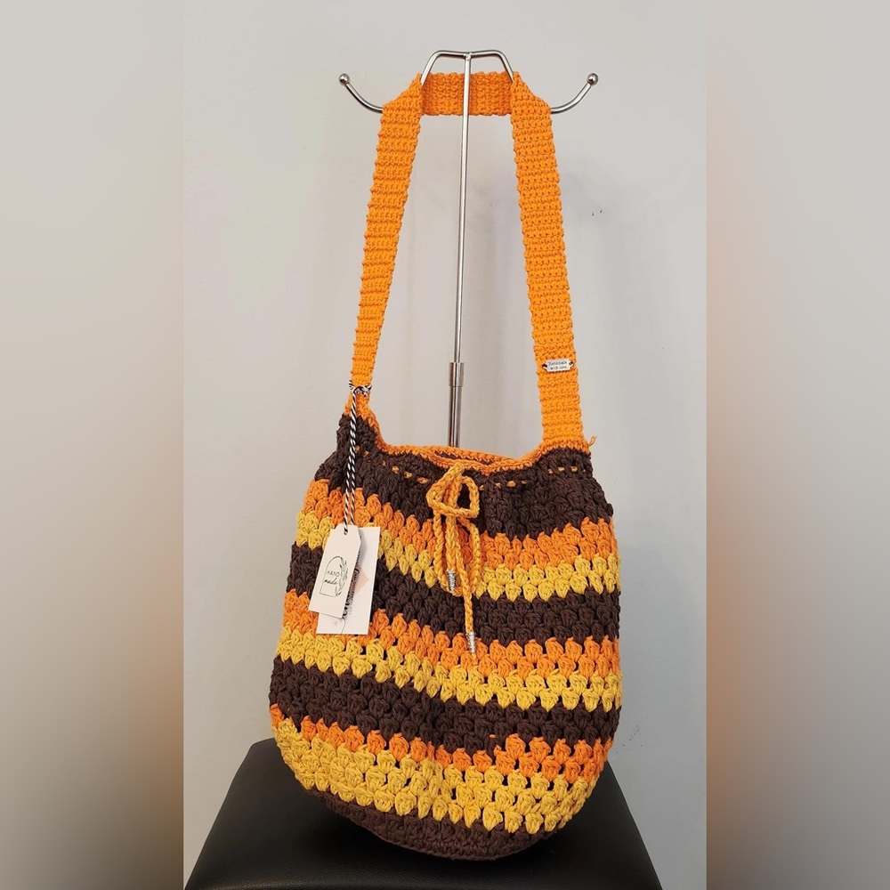 Large sized bag with thick orange strap